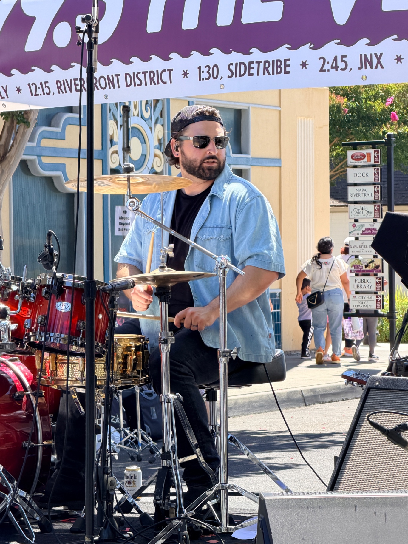 Willie Nilly drummer in shades keeping the beat on a red kit